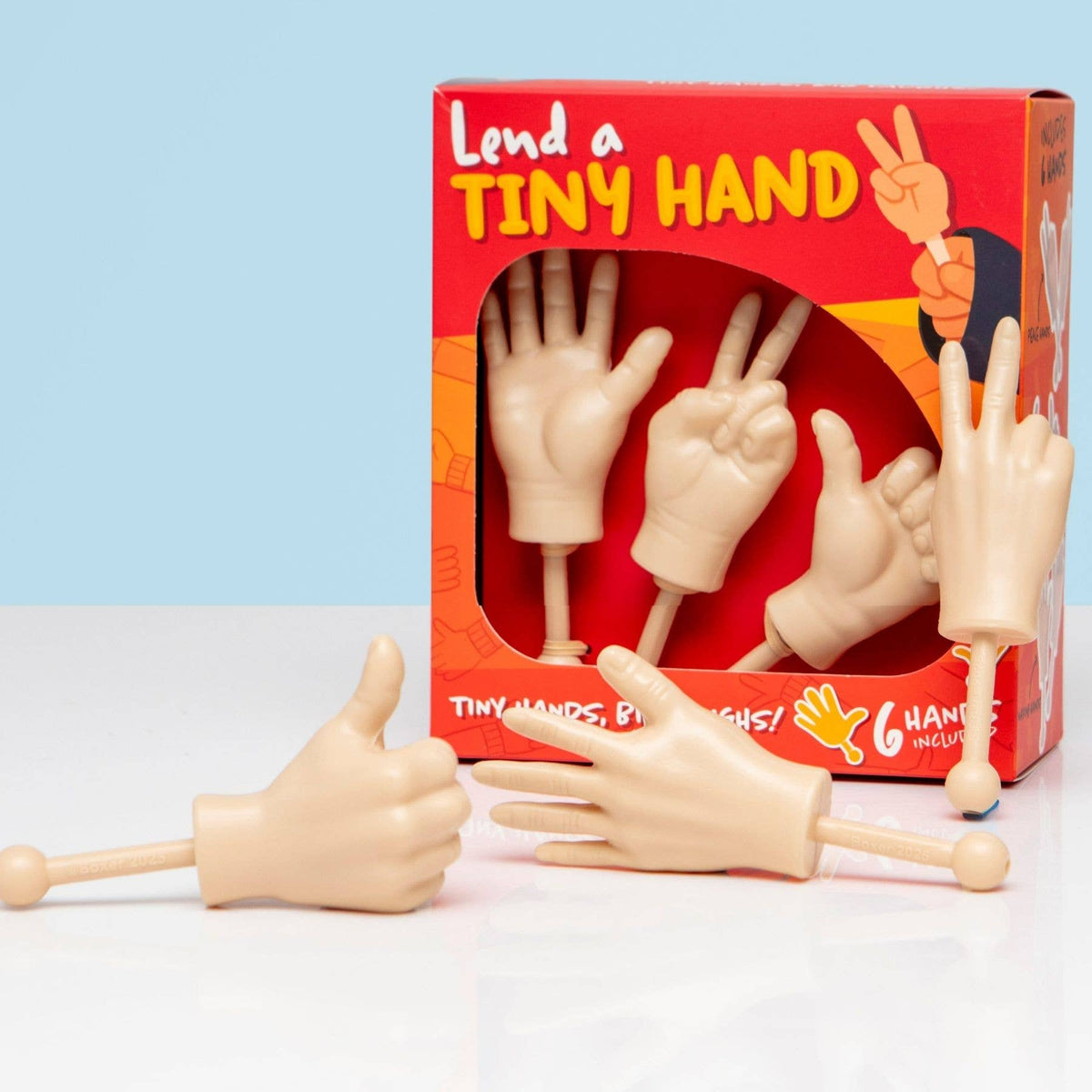 Novelty hand toy gift set in red window box with finger-shaped hand pieces on sticks