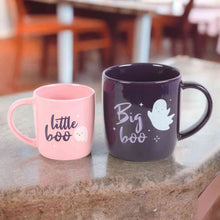 Pair of Halloween mugs on a tabletop: pink “little boo” and dark purple “big boo”