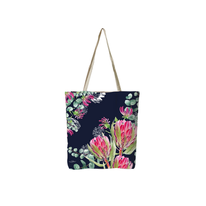 Navy reusable tote bag with pink tropical flowers and green foliage, long canvas handles