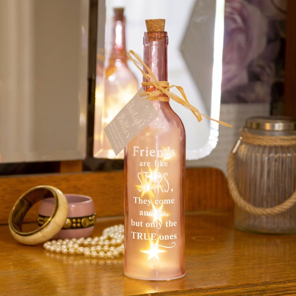 Pink starlight bottle with cork, tied bow, and Friends are like STARS glow label.