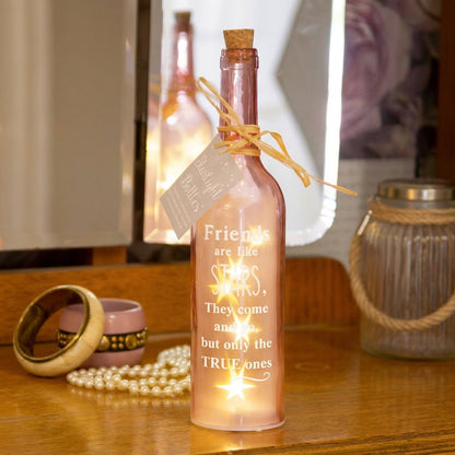 Pink starlight bottle with cork, tied bow, and Friends are like STARS glow label.