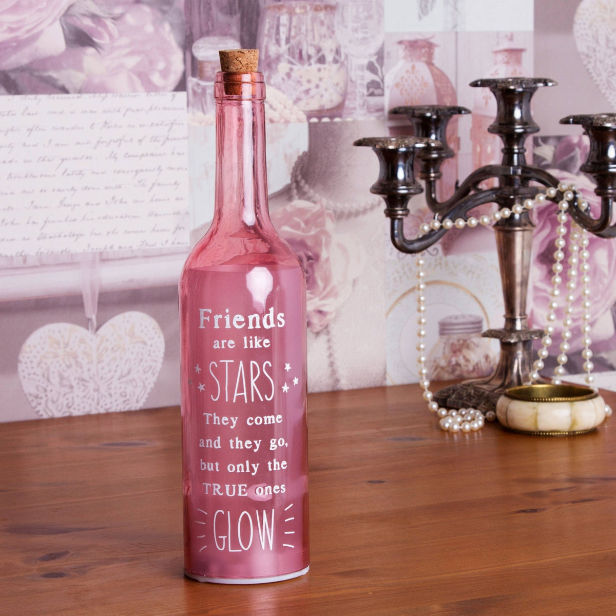 Pink starlight bottle with cork and Friends are like STARS quote, glowing on label.