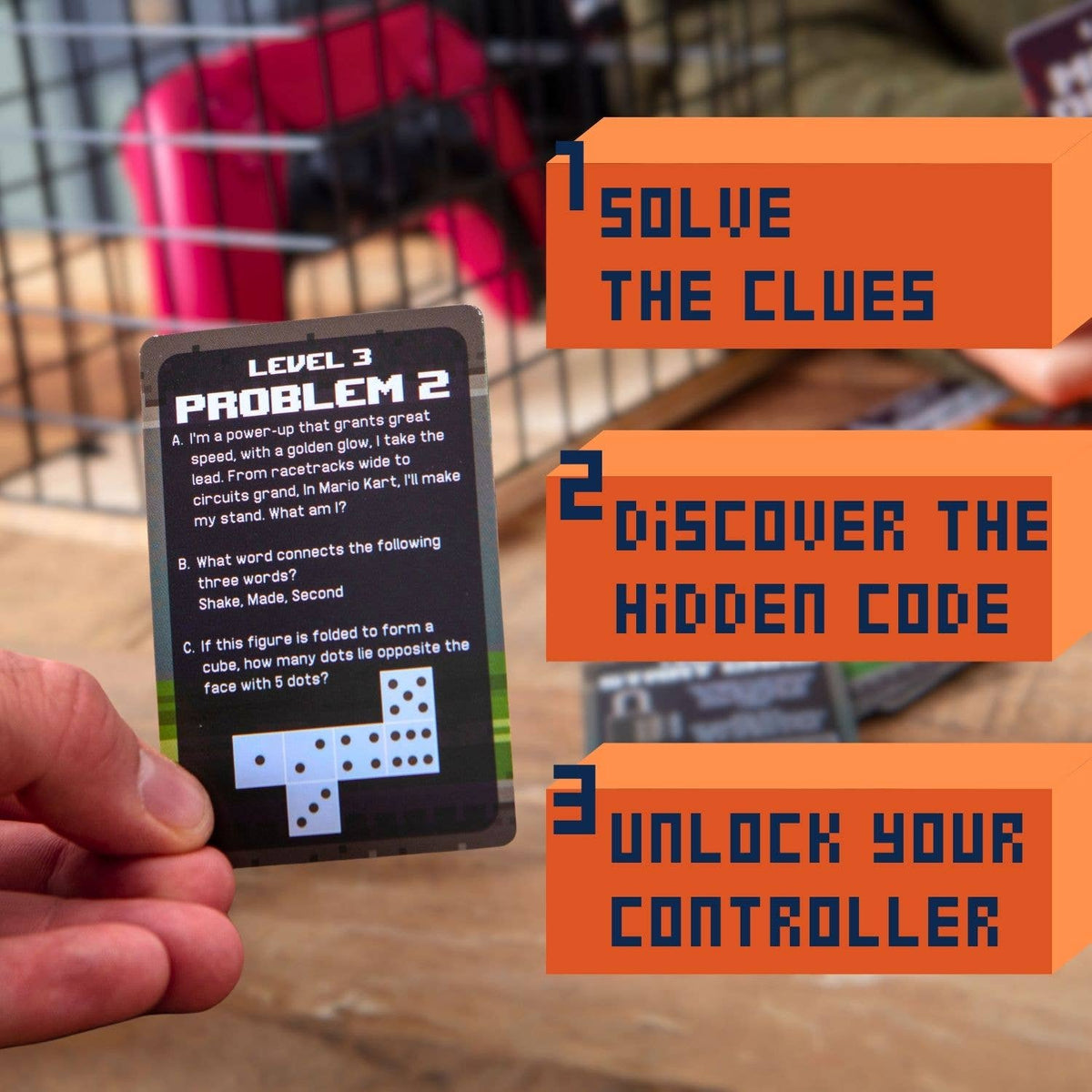 Child hands holding a puzzle level card beside a wire cage and game pieces