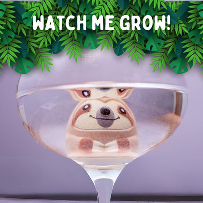 Egg-shaped sloth toy inside a clear cup of water, viewed close-up