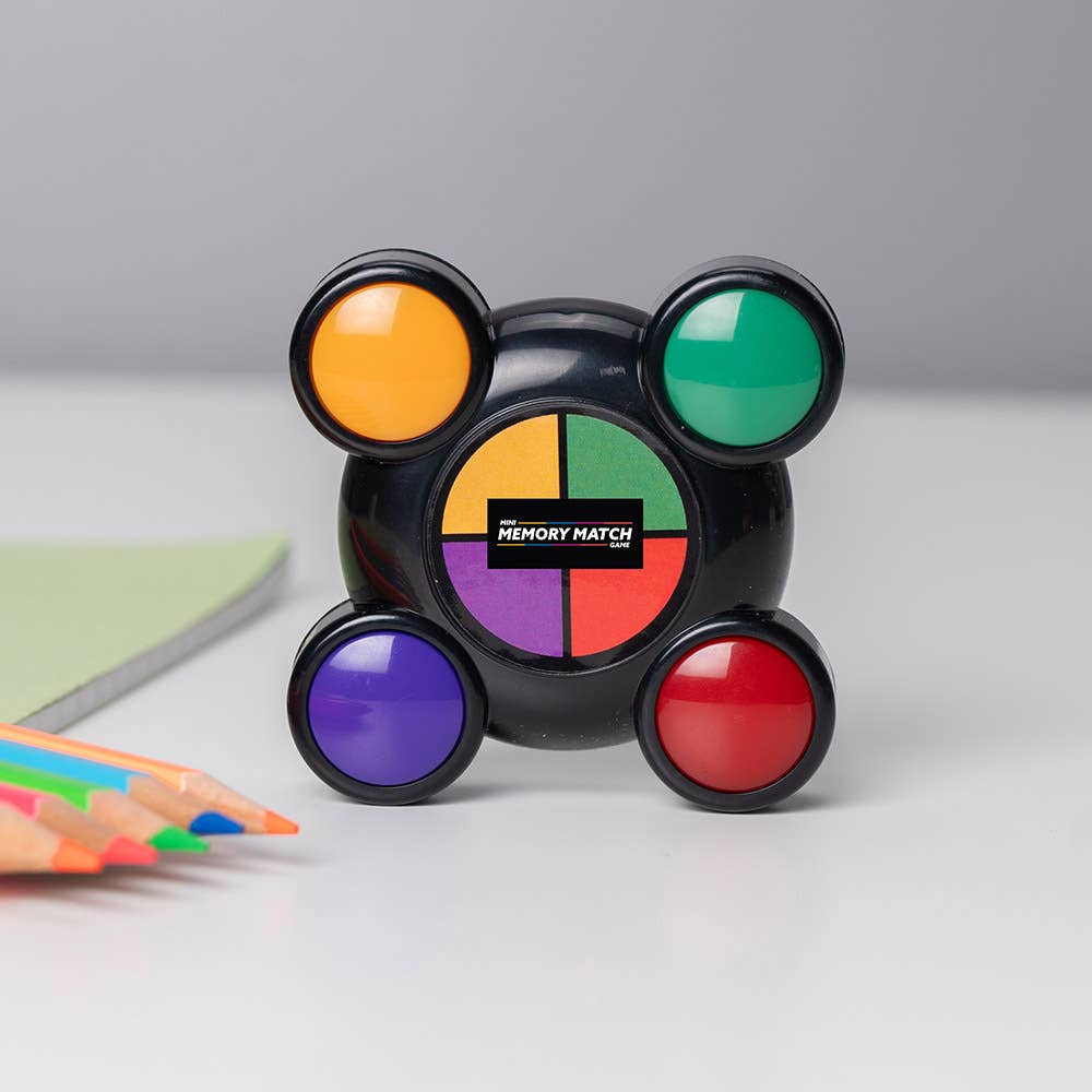 Mini Memory Match game with four colored lights and a rotating center disk, black base