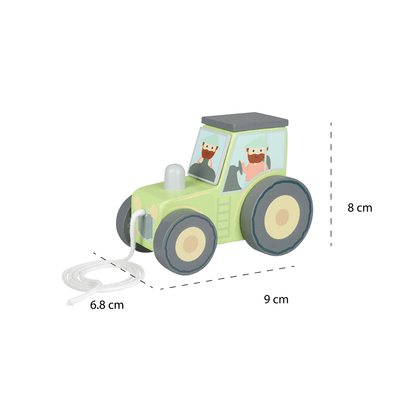 Green wooden tractor toy with gray wheels, dimensions 6.8 cm by 9 cm by 8 cm