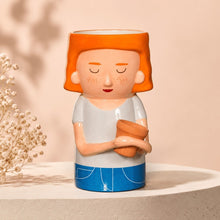Quirky Turkey Gifts dolomite vase shaped like a red-haired lady holding a mini planter for succulents or flowers
