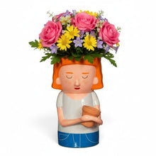 Quirky Turkey Gifts dolomite vase shaped like a red-haired lady holding a mini planter filled with colourful flowers