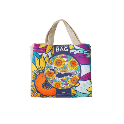 Reusable shopping bag in colorful sunflower dachshund print with 'SHOPPING BAG' label