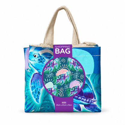 Reusable shopping tote bag with teal sea turtle print and front size graphic
