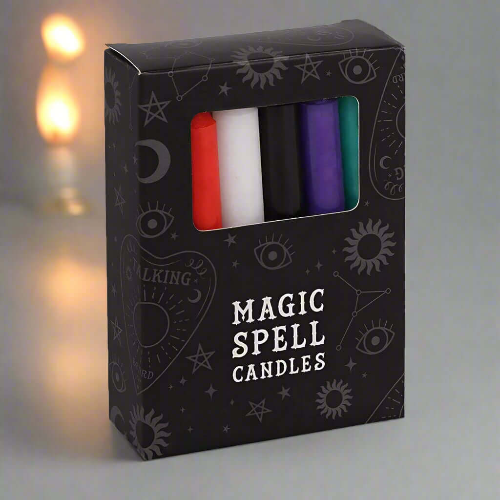 Magic spell candles gift box showing red, white, purple, and green pillar candles