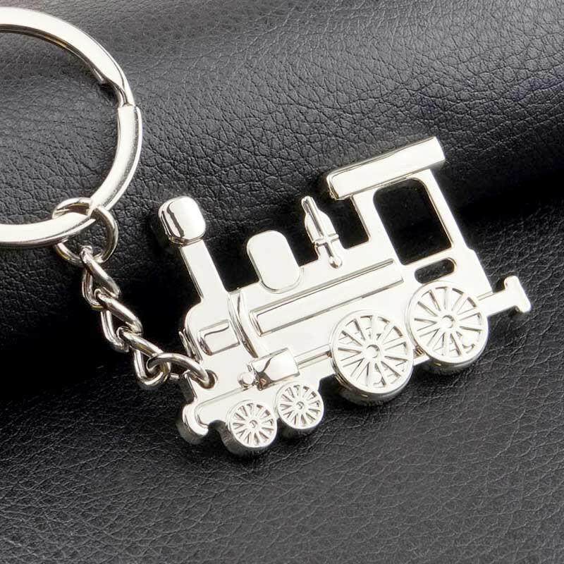 Silver train locomotive keyring charm with keyring loop and chain, side view